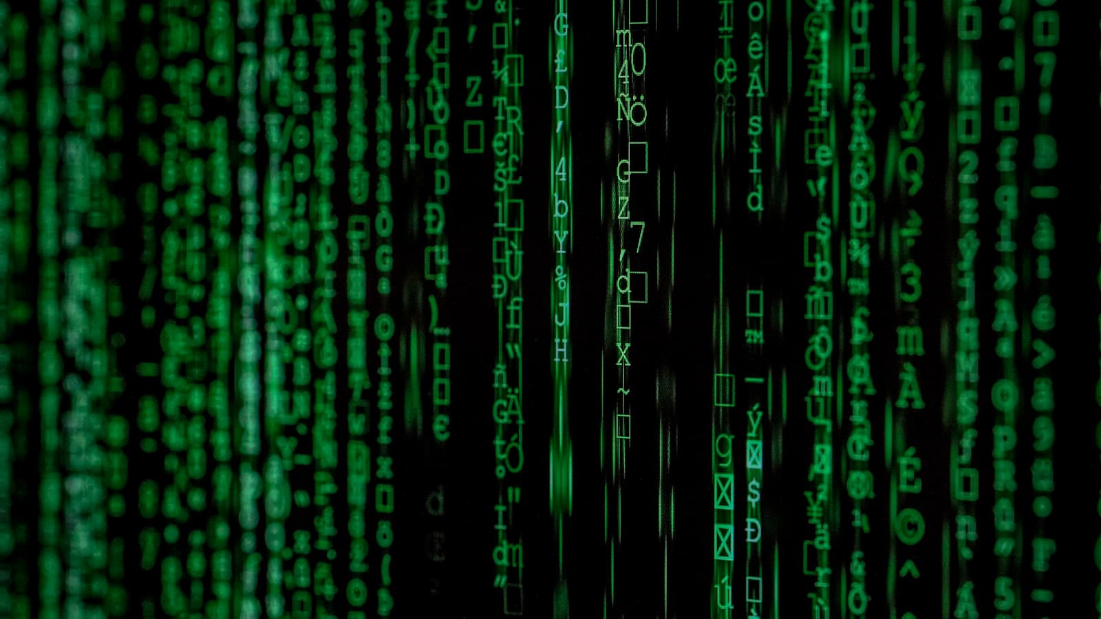 Green cascading characters on a black screen in the style of falling code