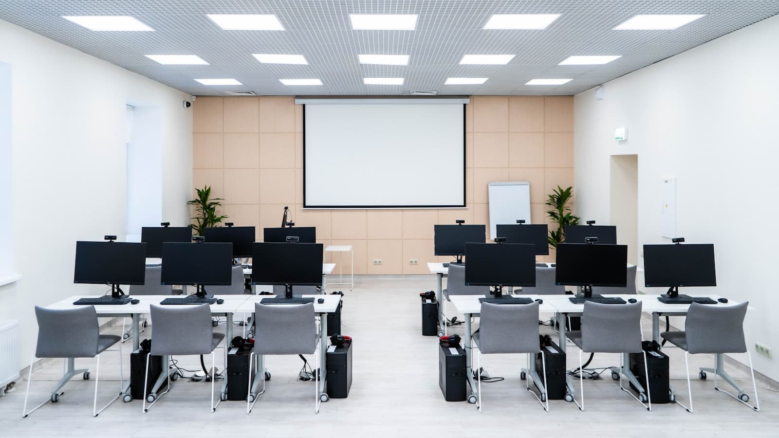 A room filled with lots of desks and computers
